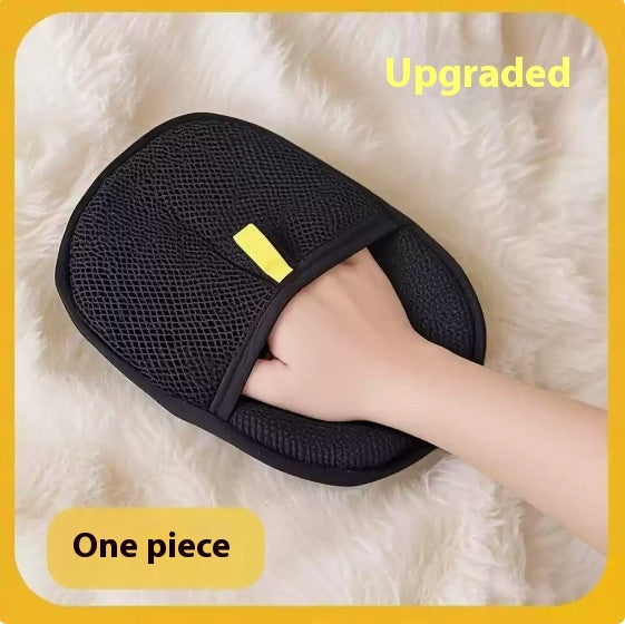 Black FurLift grooming mitt used on soft pet fur